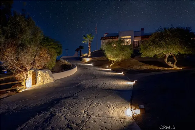 a view of a chairs and table in the patio