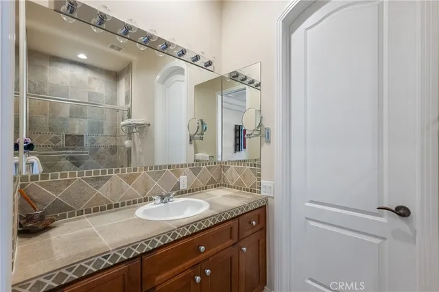a view of a chair and table in a back yard