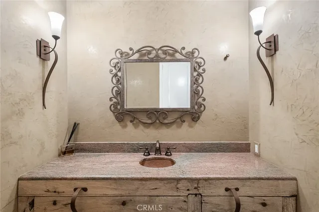 a view of a room with a wooden bench and painted walls