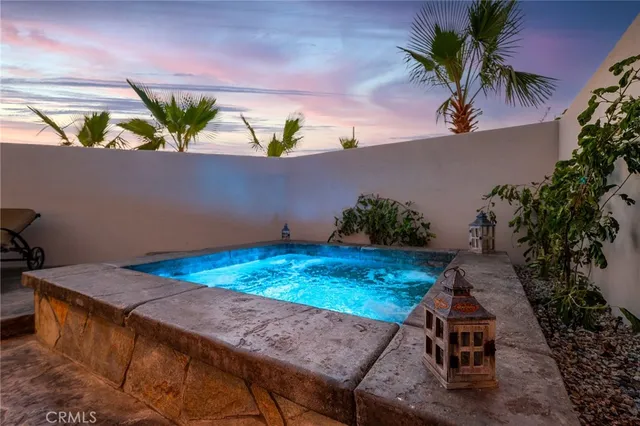 a view of swimming pool with a yard