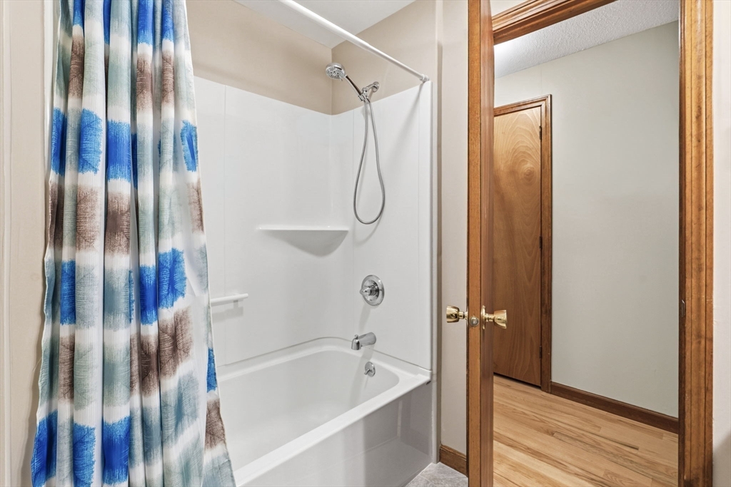 788 Burts Pit Road Northampton, MA 01062 - Photo 27 of 42 a bathroom with a bathtub and a shower
