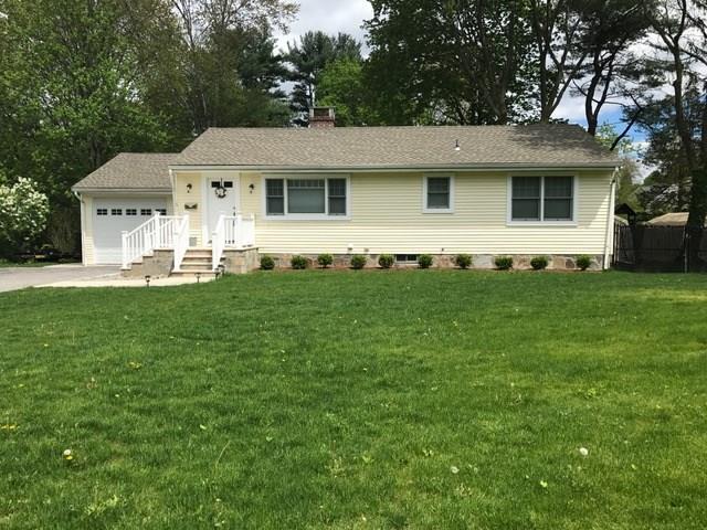 16 Lloyd Road Norwalk, CT 06850 - Photo 1 of 1 a front view of a house with a yard