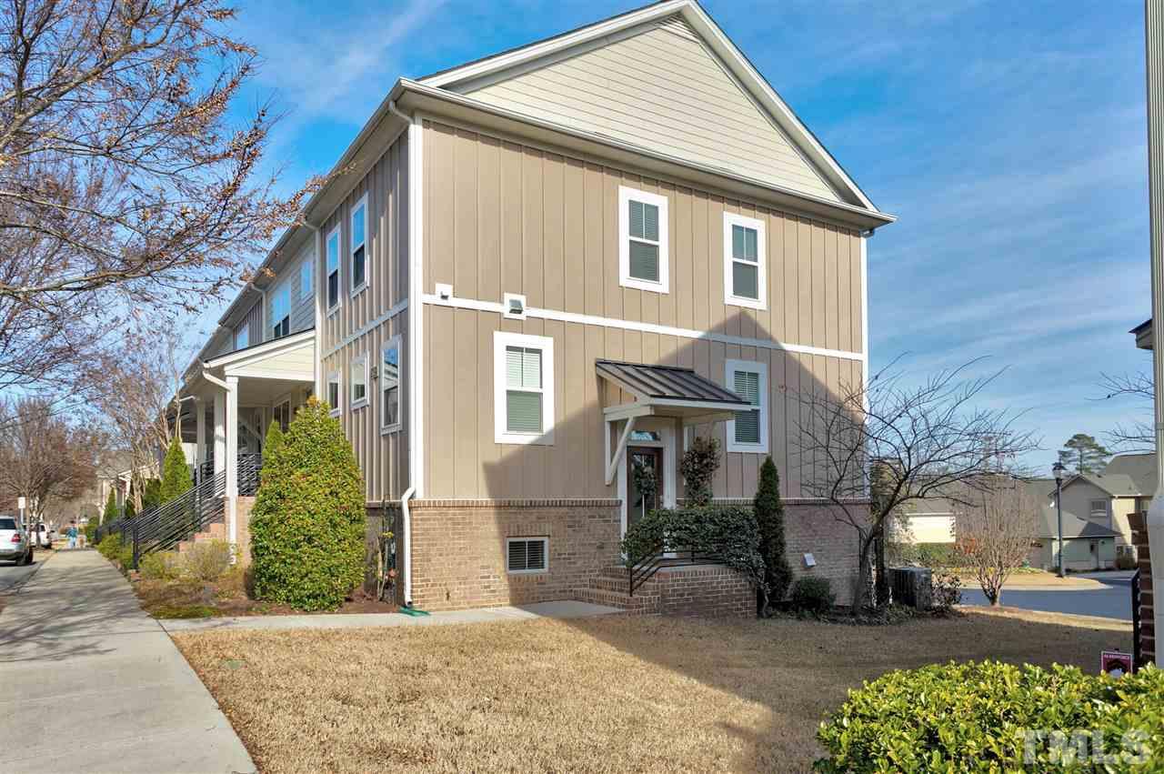 1412 Crafton Way Raleigh, NC 27607 - Photo 1 of 25 a view of a white house with large windows