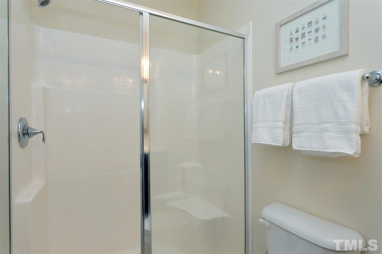 1412 Crafton Way Raleigh, NC 27607 - Photo 16 of 25 a bathroom with a shower and toilet
