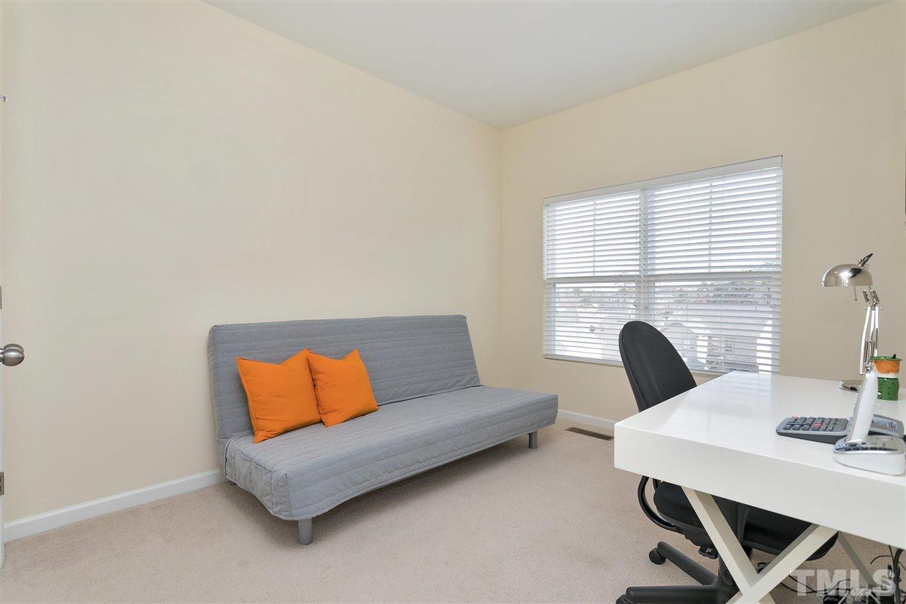 1412 Crafton Way Raleigh, NC 27607 - Photo 17 of 25 a living room with furniture and a window