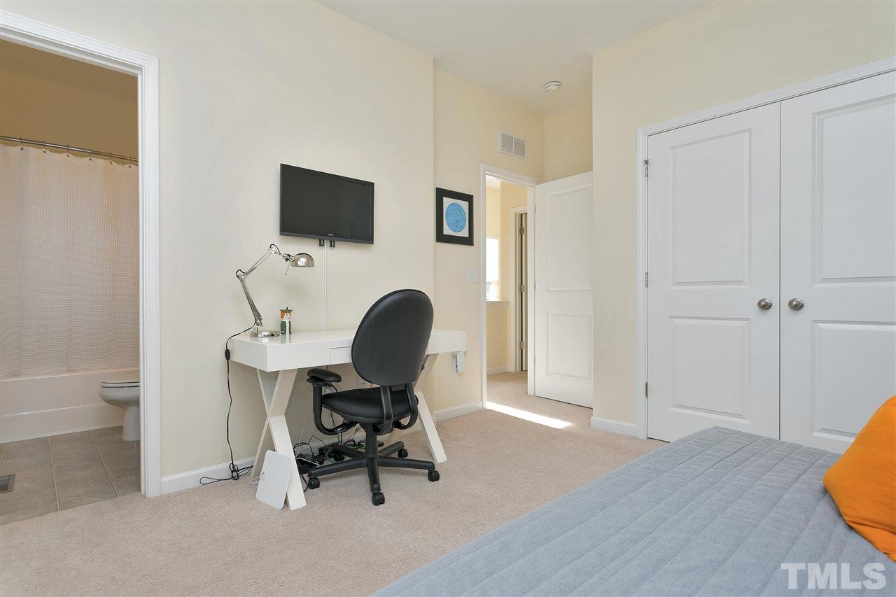 1412 Crafton Way Raleigh, NC 27607 - Photo 18 of 25 a workspace with furniture and a flat screen tv