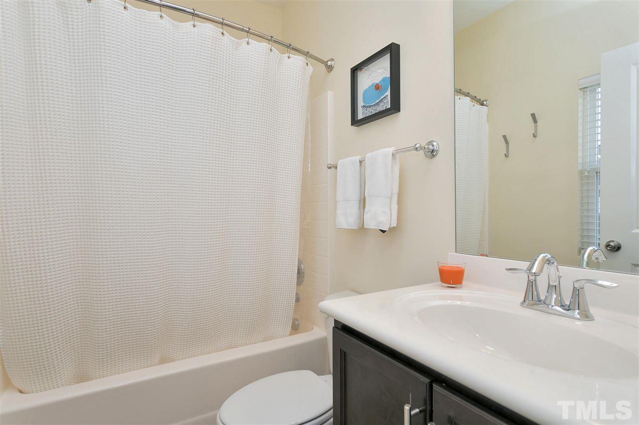 1412 Crafton Way Raleigh, NC 27607 - Photo 19 of 25 a bathroom with a sink toilet and shower