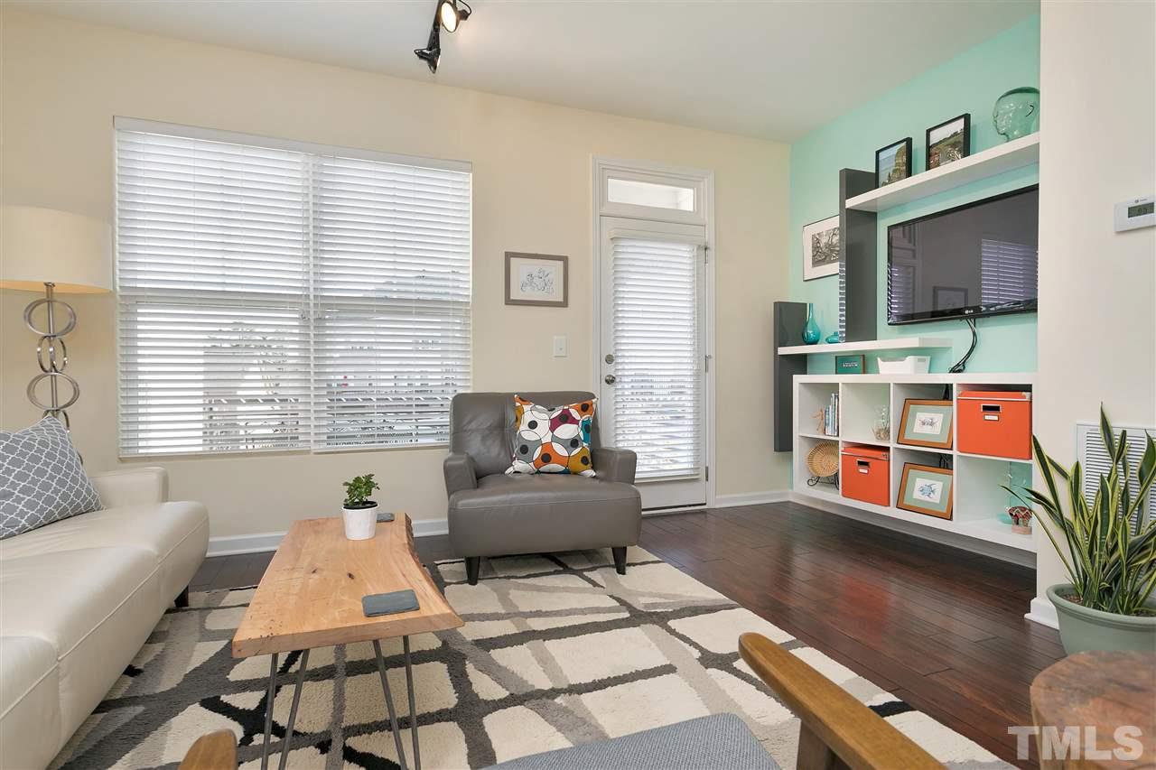 1412 Crafton Way Raleigh, NC 27607 - Photo 4 of 25 a living room with furniture and a flat screen tv