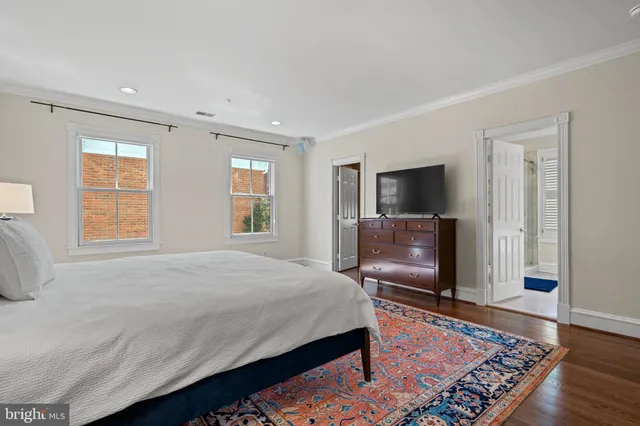 a bedroom with a bed and a television in it