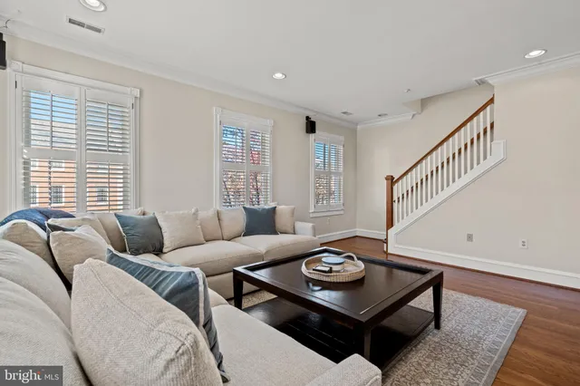 a living room with furniture and a table