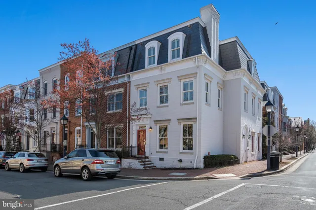 a city street lined with buildings and cars