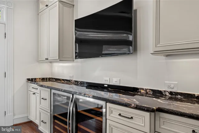 a kitchen with granite countertop a stove and a microwave