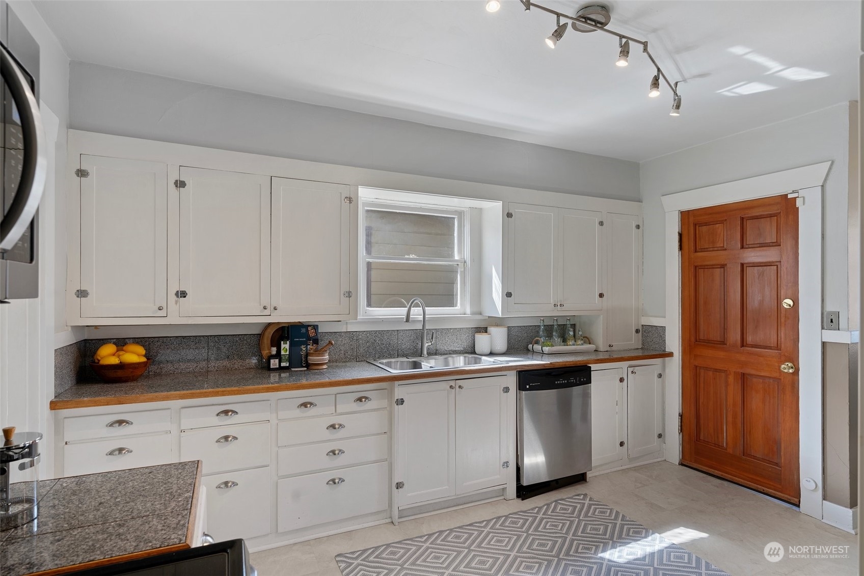 3630 Rockefeller Avenue Everett, WA 98201 - Photo 11 of 30 a kitchen with stainless steel appliances granite countertop a sink stove and cabinets