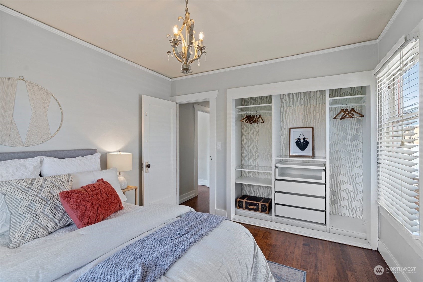 3630 Rockefeller Avenue Everett, WA 98201 - Photo 17 of 30 a bedroom with a large bed and chandelier