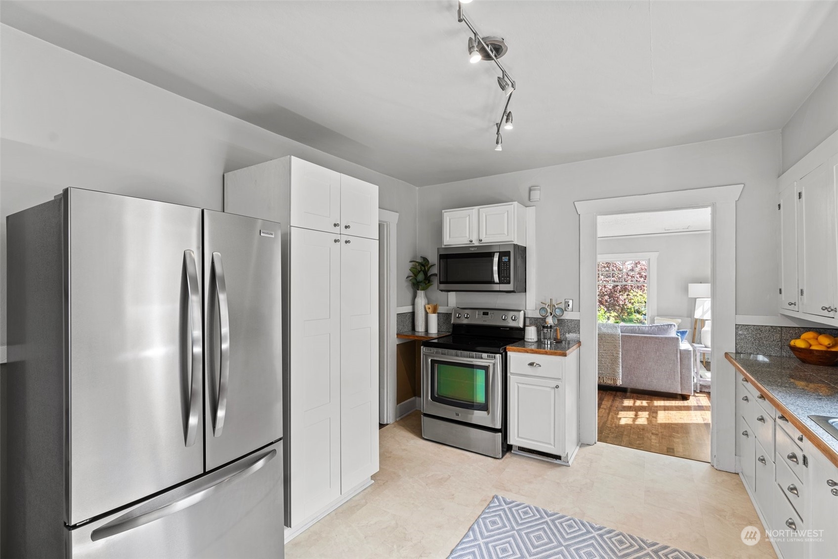 3630 Rockefeller Avenue Everett, WA 98201 - Photo 9 of 30 a kitchen with stainless steel appliances a refrigerator sink and stove