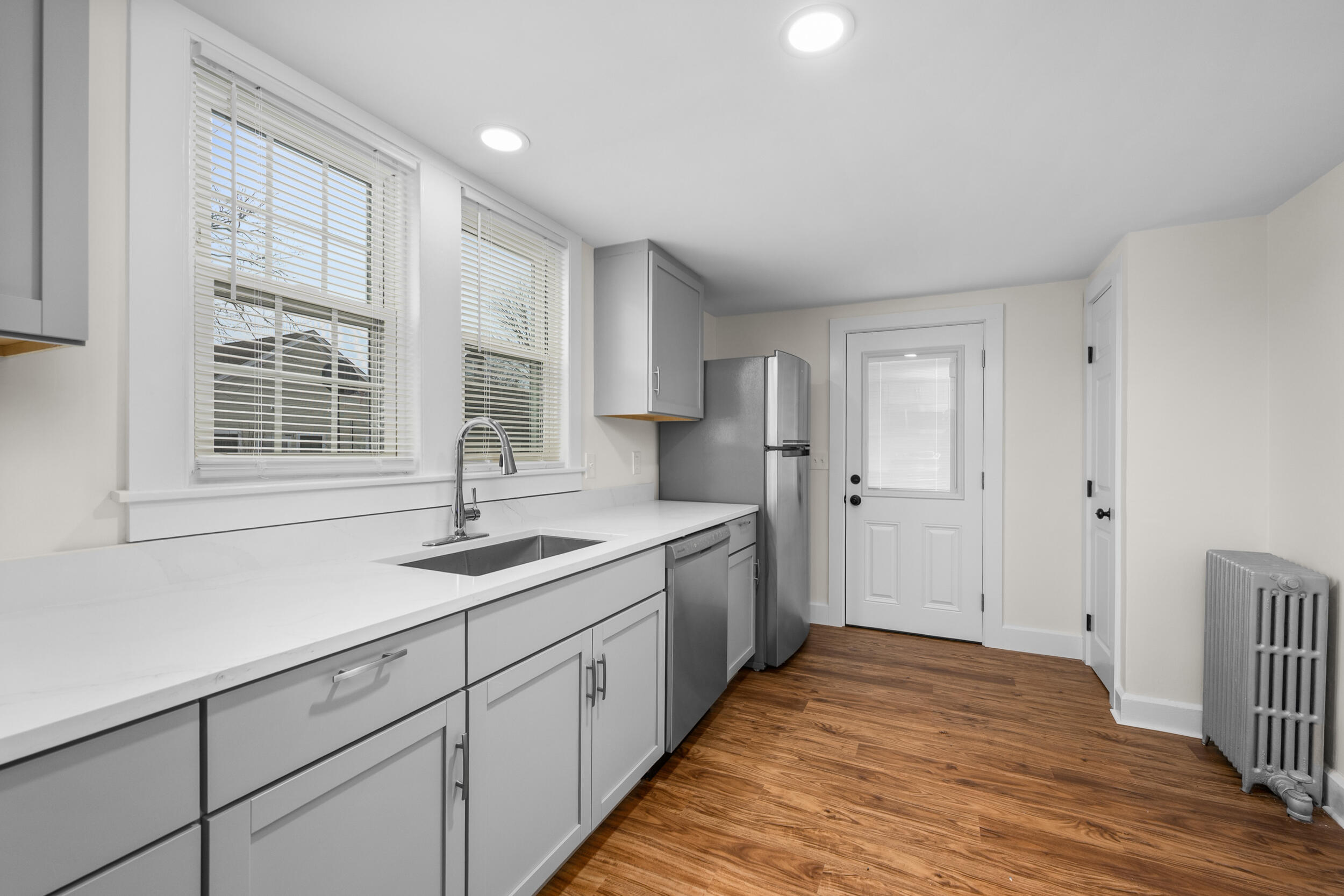 45 Louis Street Hyannis, MA 02601 - Photo 11 of 21 a kitchen with a sink stove and cabinets