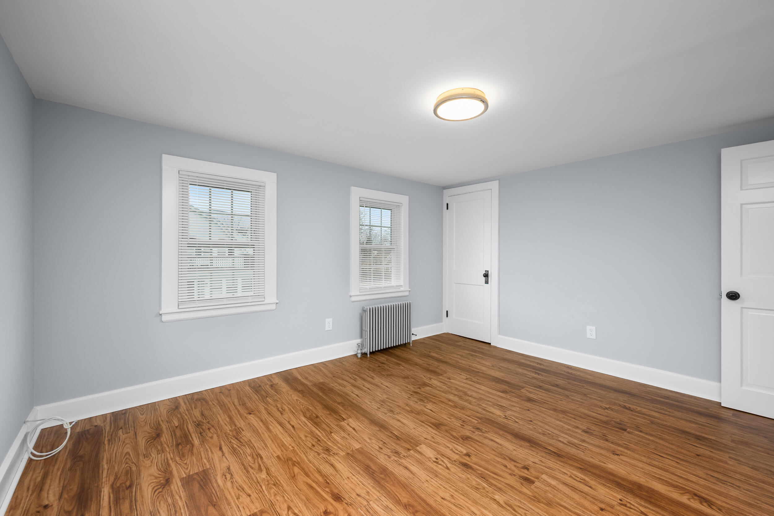 45 Louis Street Hyannis, MA 02601 - Photo 14 of 21 a view of empty room with wooden floor and fan
