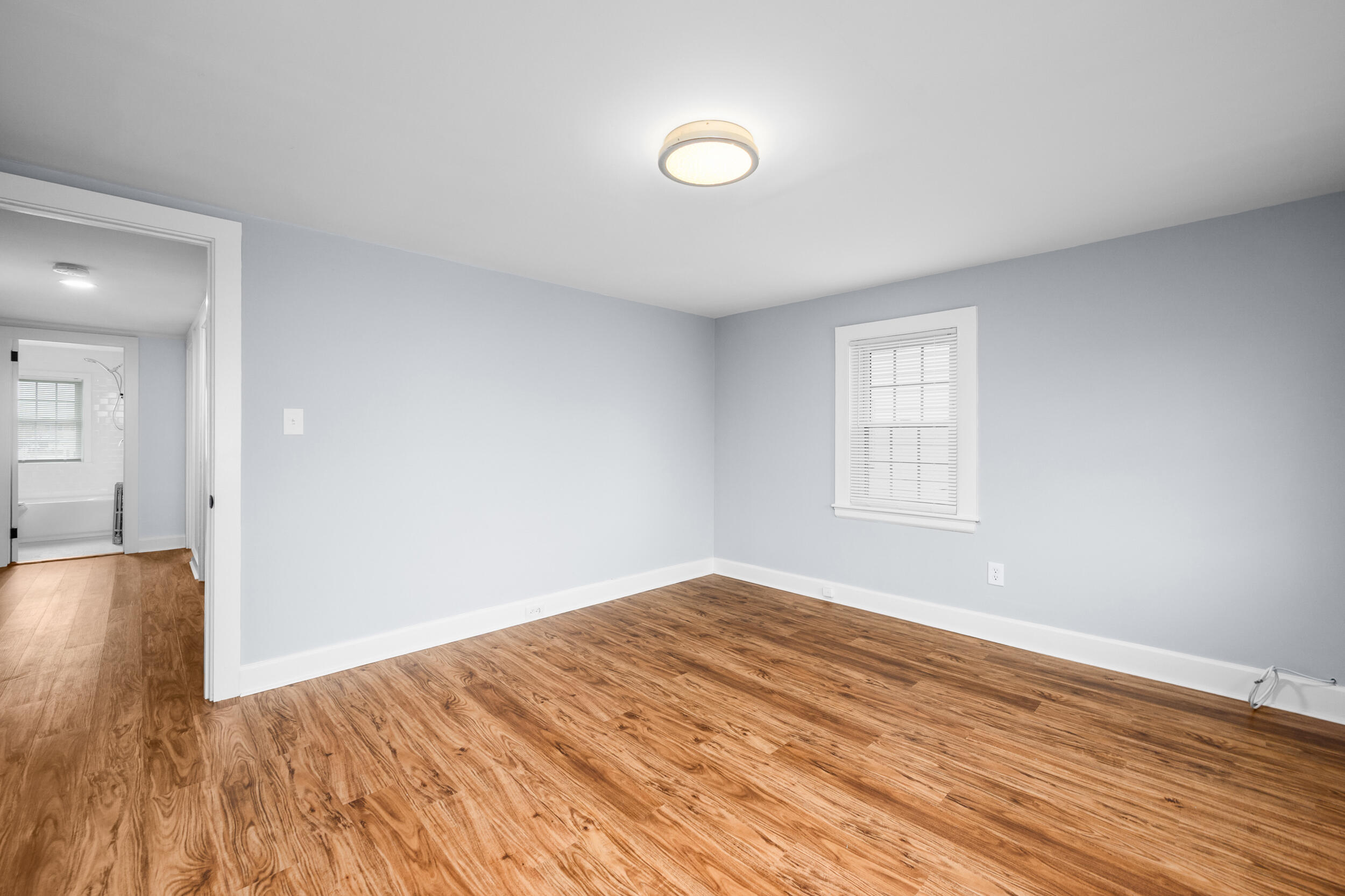 45 Louis Street Hyannis, MA 02601 - Photo 15 of 21 wooden floor in an empty room with a window
