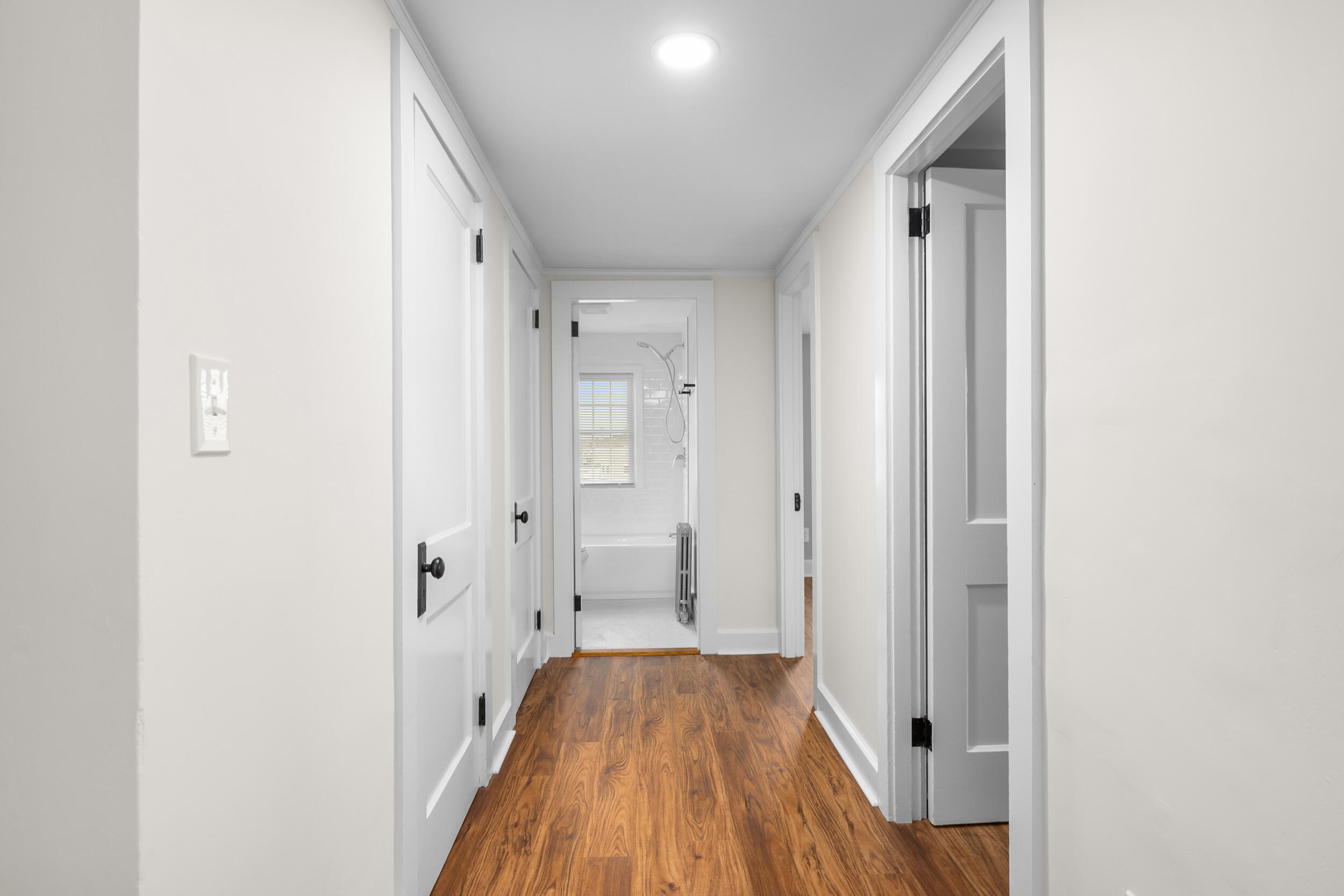 45 Louis Street Hyannis, MA 02601 - Photo 16 of 21 a view of a room with wooden floor and a bathroom
