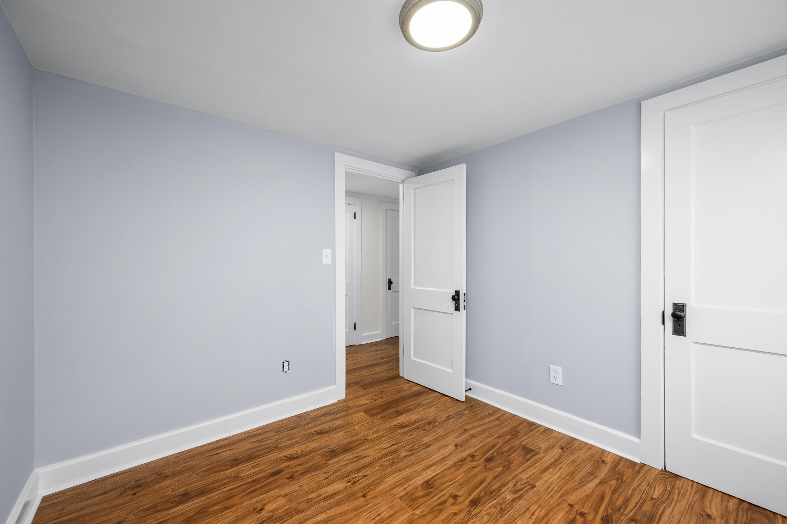 45 Louis Street Hyannis, MA 02601 - Photo 18 of 21 a view of an empty room and wooden floor