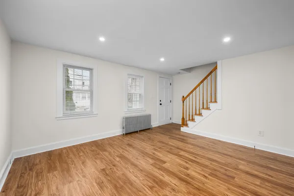 a view of an entryway with wooden floor