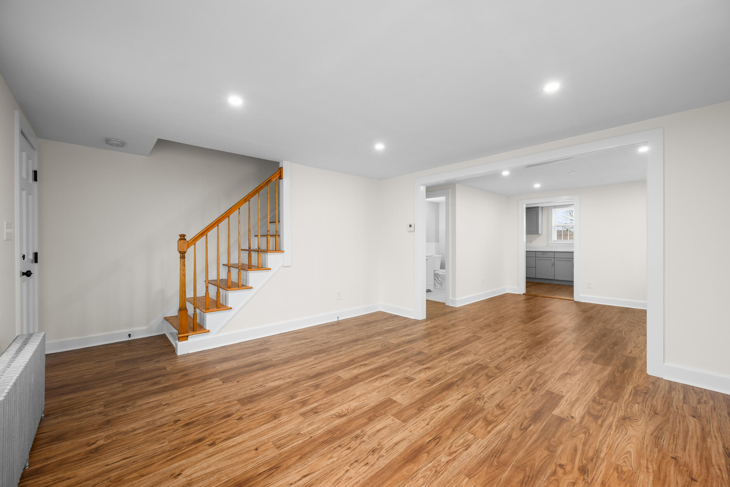 45 Louis Street Hyannis, MA 02601 - Photo 4 of 21 a view of empty room with wooden floor and stairs