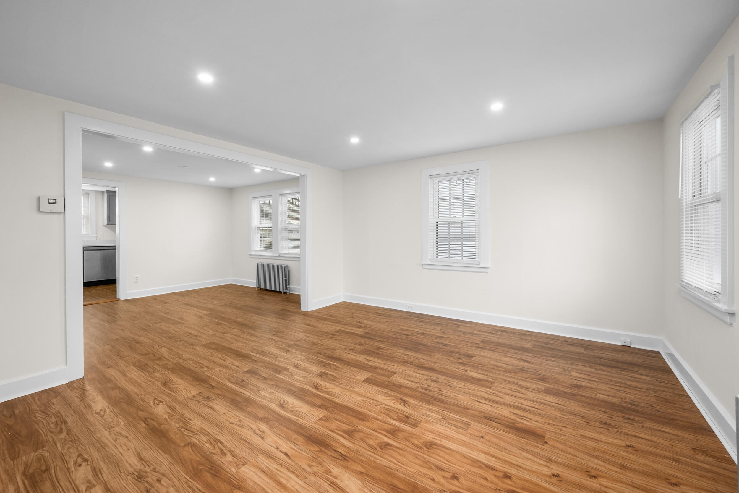 45 Louis Street Hyannis, MA 02601 - Photo 6 of 21 a view of an empty room with wooden floor and a window