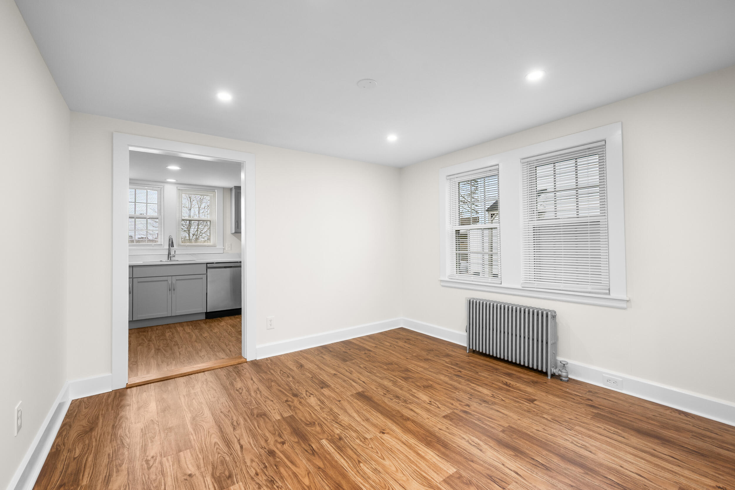 45 Louis Street Hyannis, MA 02601 - Photo 7 of 21 a view of wooden floor and a kitchen