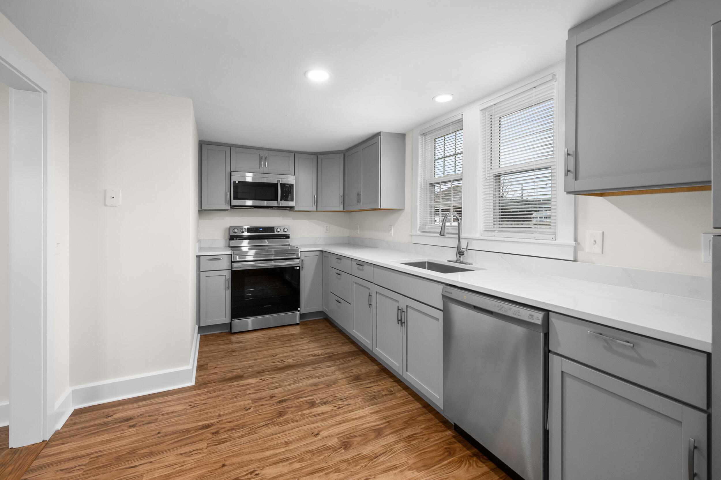 45 Louis Street Hyannis, MA 02601 - Photo 9 of 21 a kitchen with granite countertop a sink cabinets and stainless steel appliances