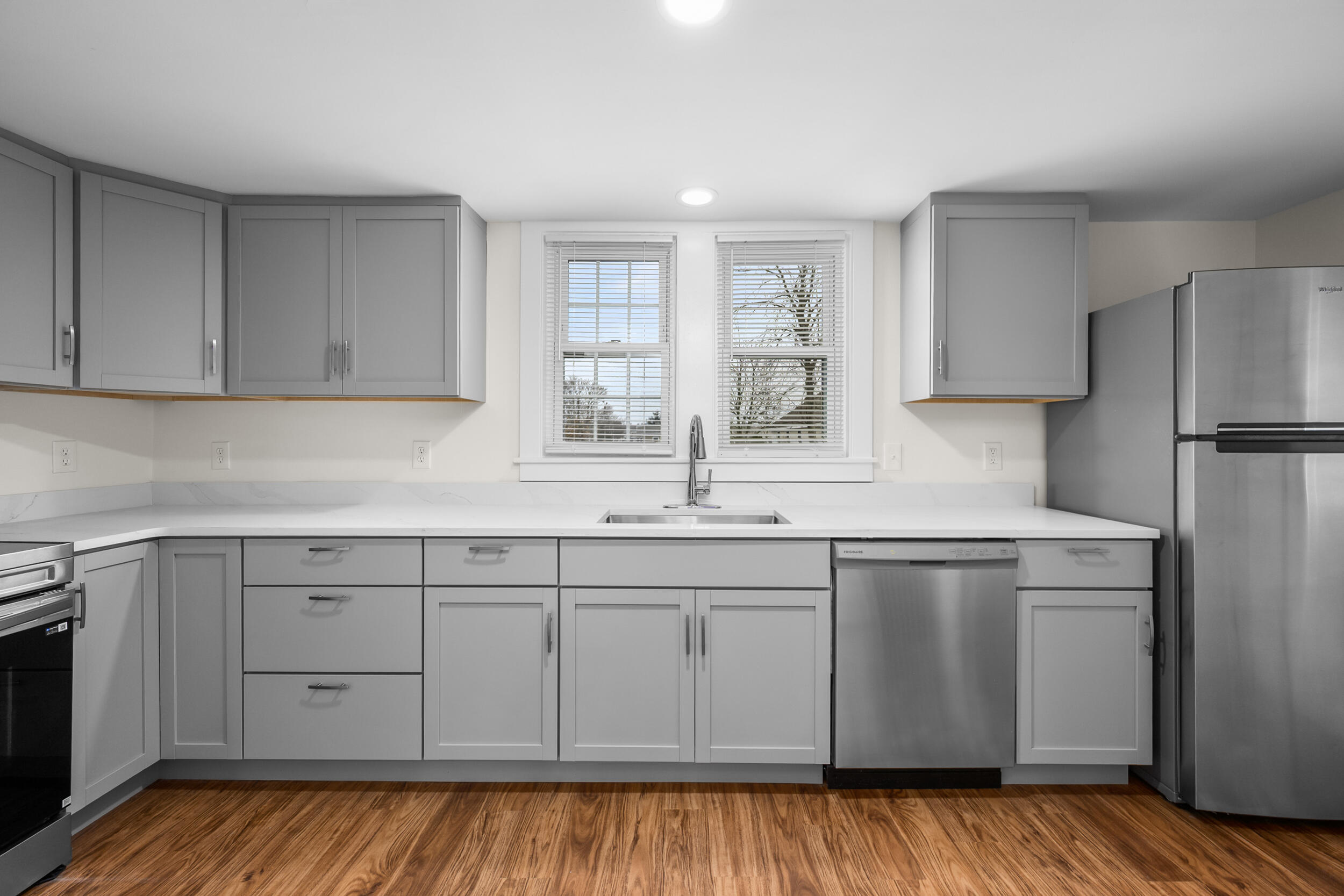 45 Louis Street Hyannis, MA 02601 - Photo 10 of 21 a kitchen with white cabinets white stainless steel appliances and sink