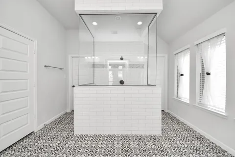 a bedroom with a large bed and a large window