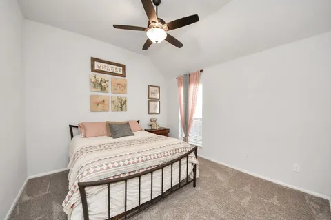 a en suite bathroom with a sink double vanity and a mirror