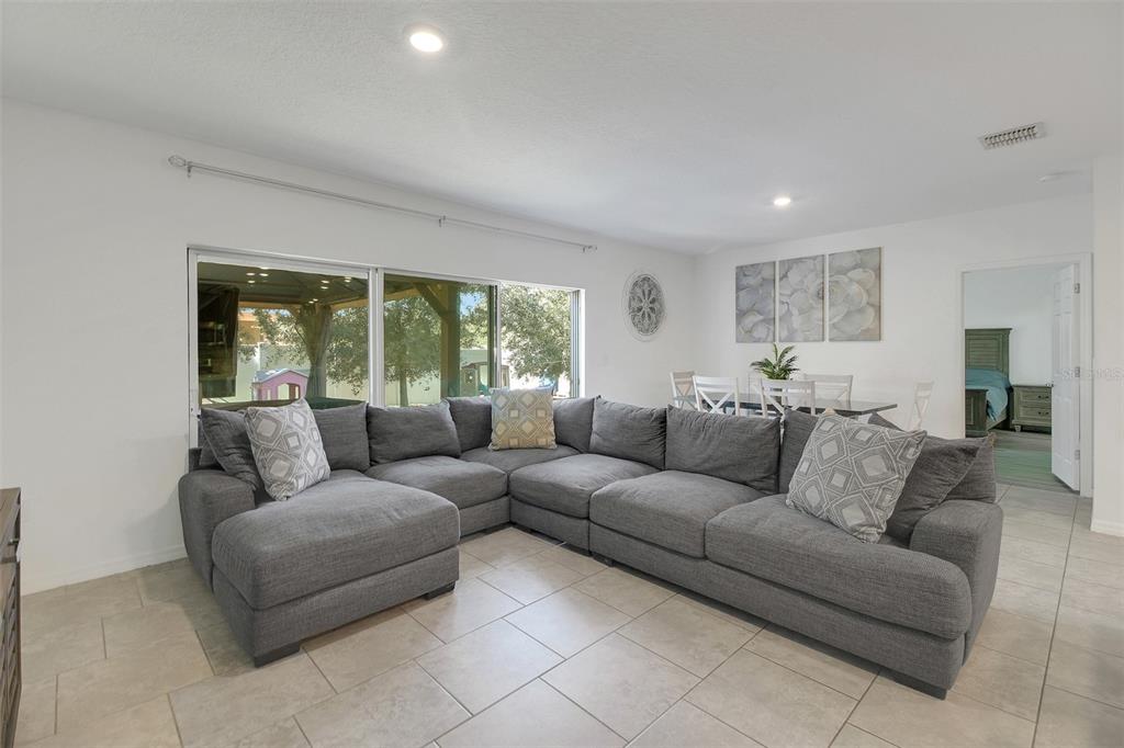 10121 Grande Loop Clermont, FL 34711 - Photo 14 of 30 a living room with furniture and a large window