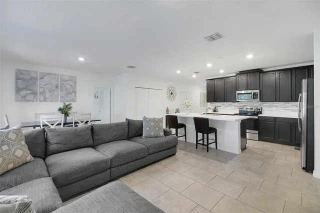a dining room with furniture and window