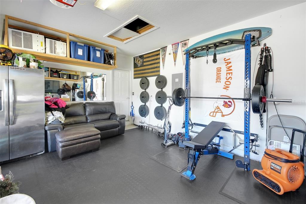 10121 Grande Loop Clermont, FL 34711 - Photo 29 of 30 a living room with furniture and a flat screen tv