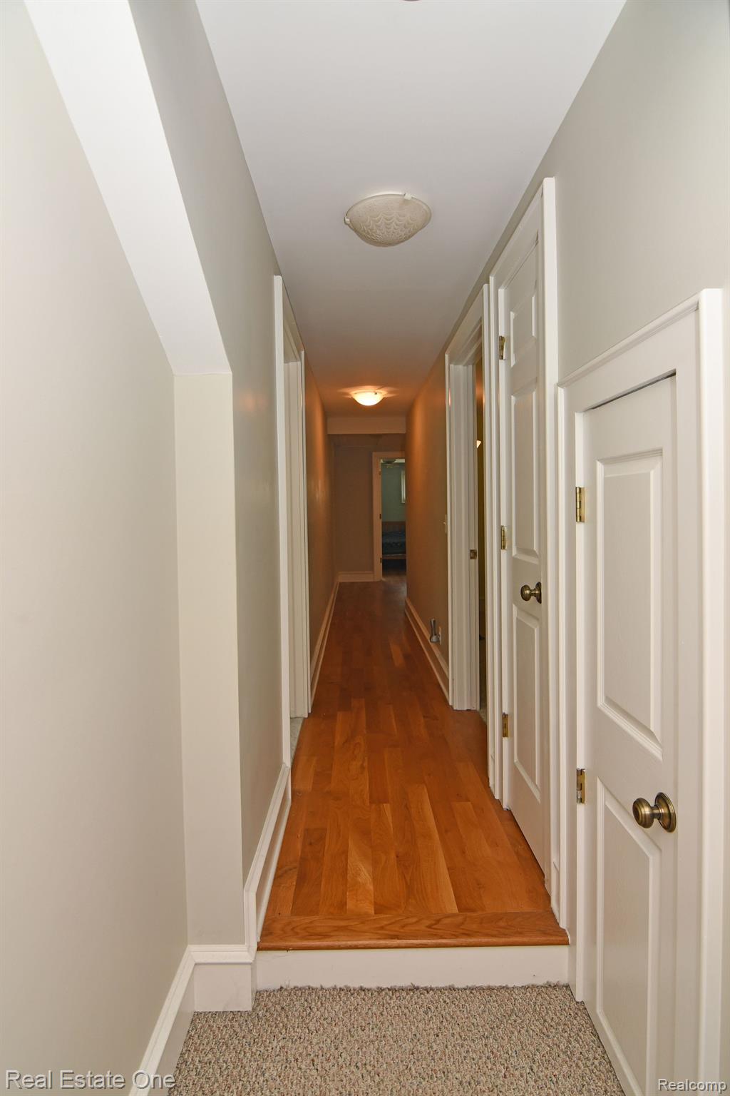 69 South Holcomb Road Clarkston, MI 48346 - Photo 56 of 68 Wood Flooring in Hallway
