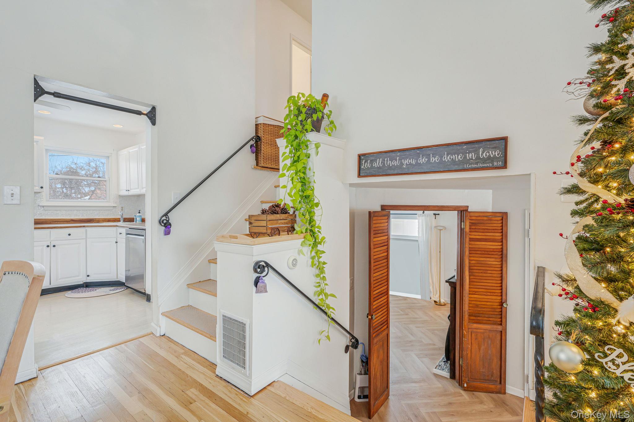 7 Seneca Drive Commack, NY 11725 - Photo 16 of 40 Staircase featuring parquet flooring and a high ceiling