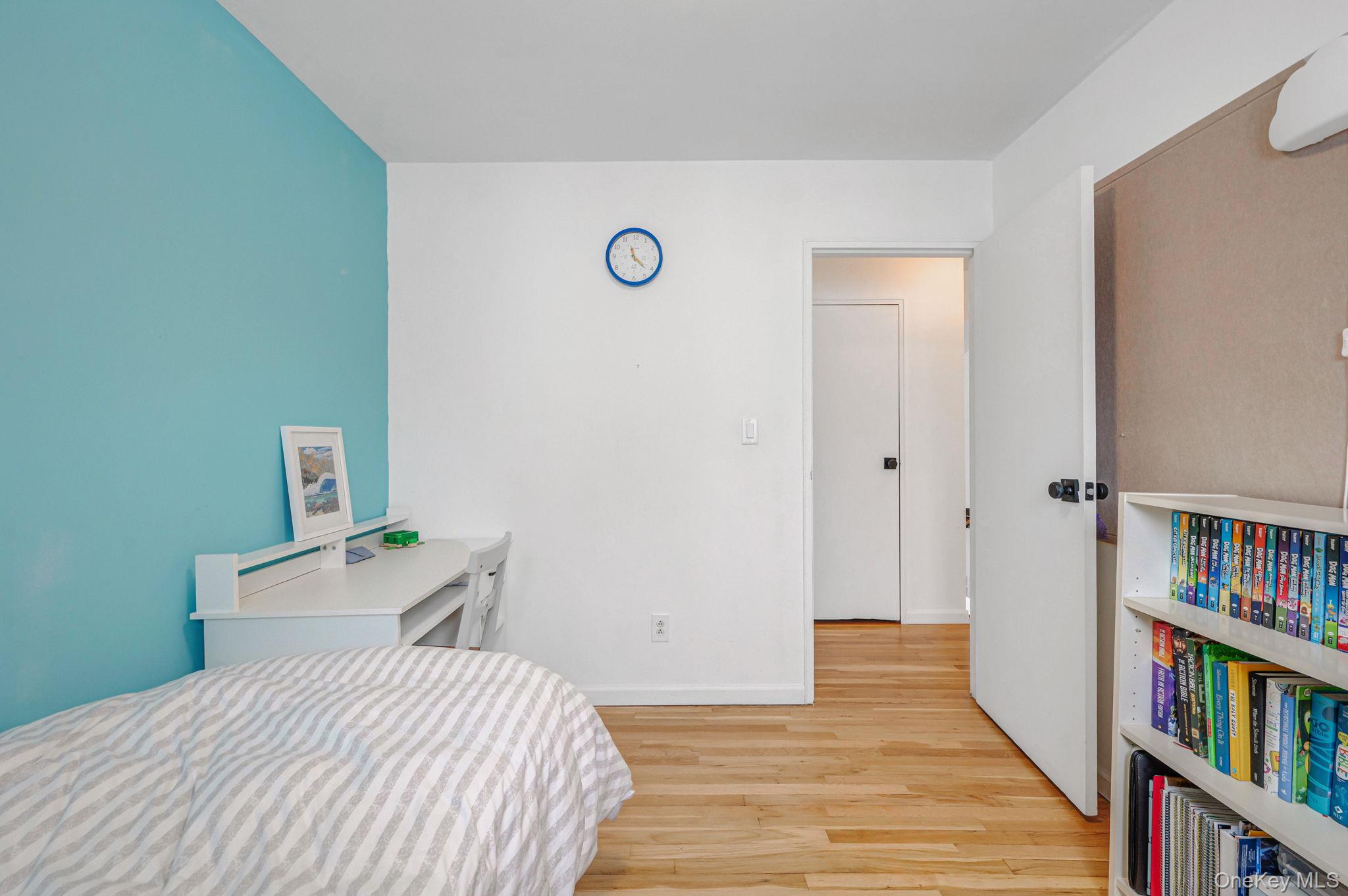 7 Seneca Drive Commack, NY 11725 - Photo 24 of 40 Bedroom featuring light wood-type flooring and baseboards