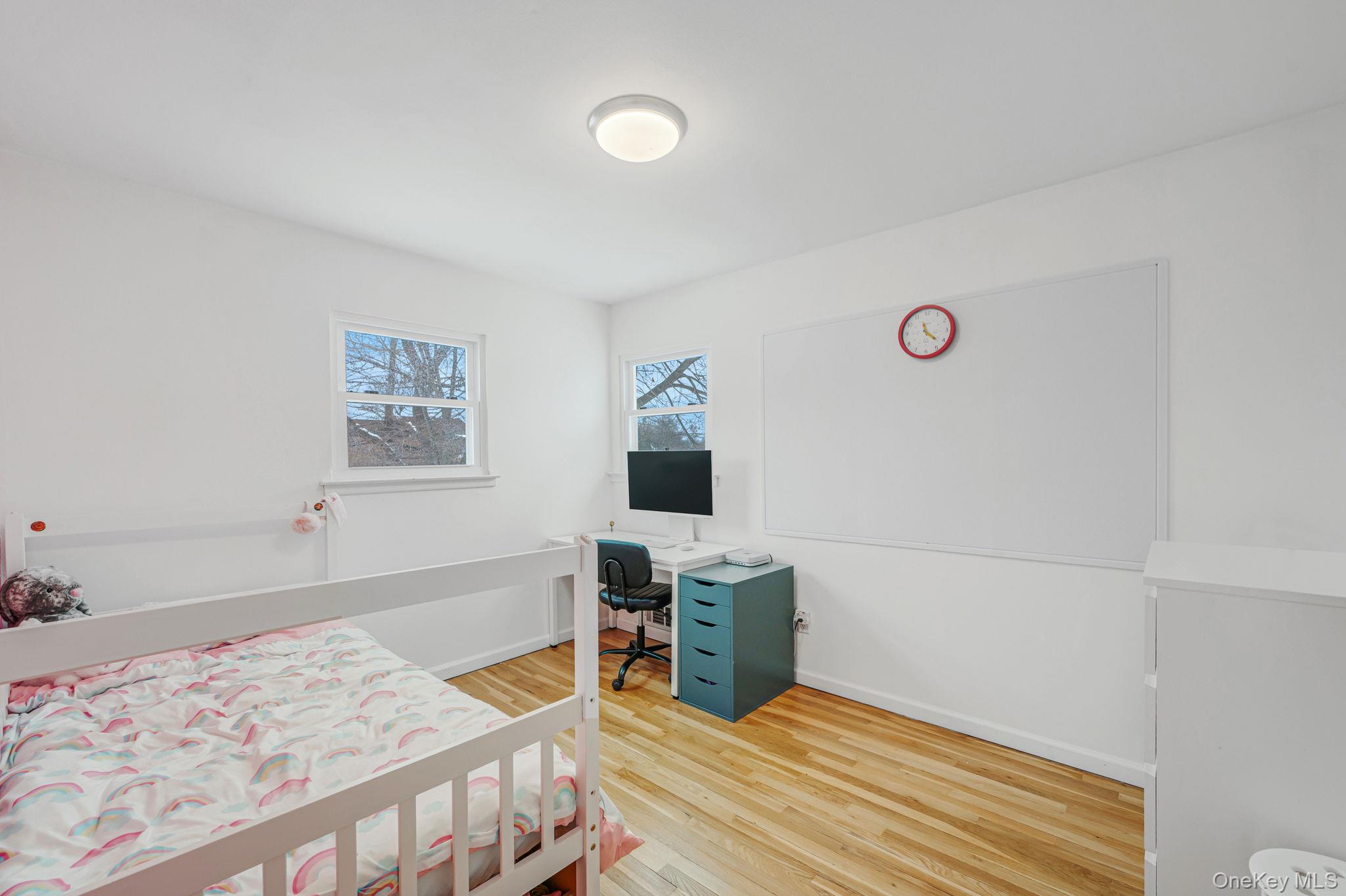 7 Seneca Drive Commack, NY 11725 - Photo 25 of 40 Bedroom featuring light wood-type flooring and a desk