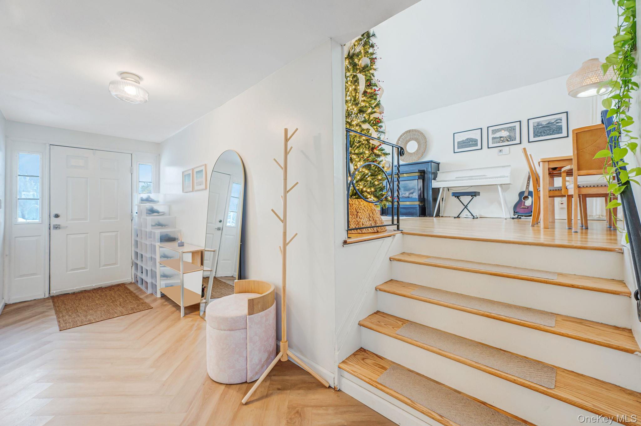 7 Seneca Drive Commack, NY 11725 - Photo 5 of 40 Entrance foyer featuring arched walkways and stairs