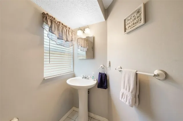 a bathroom with a sink and mirror