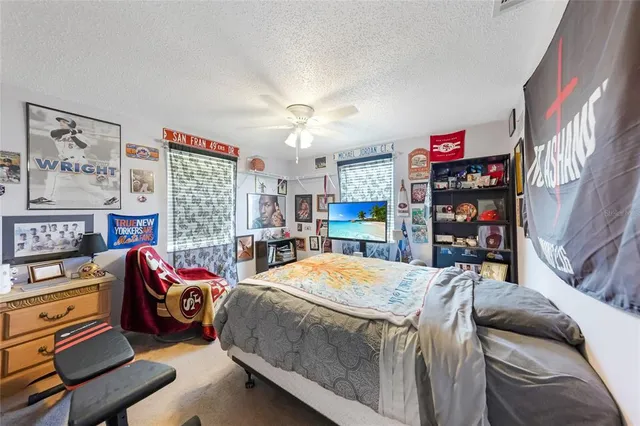 a bedroom with a bed and a bookshelf