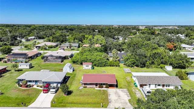 an aerial view of a house with swimming pool yard and outdoor seating