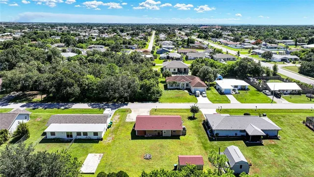 a view of house with outdoor space and garden