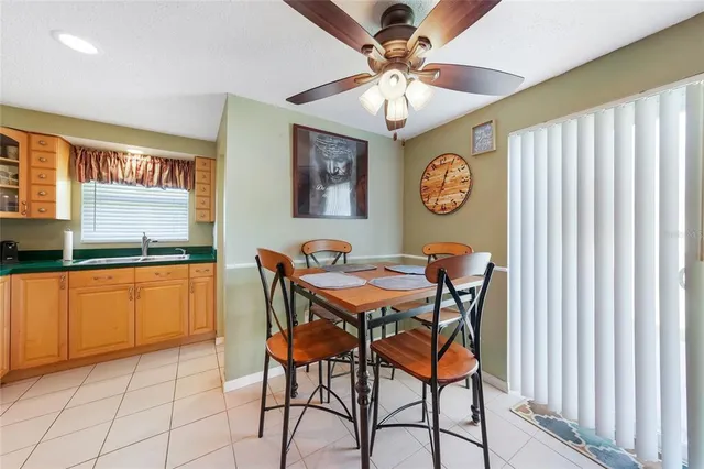 a view of a room with furniture and chandelier