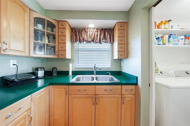 a kitchen with a sink and a cabinets