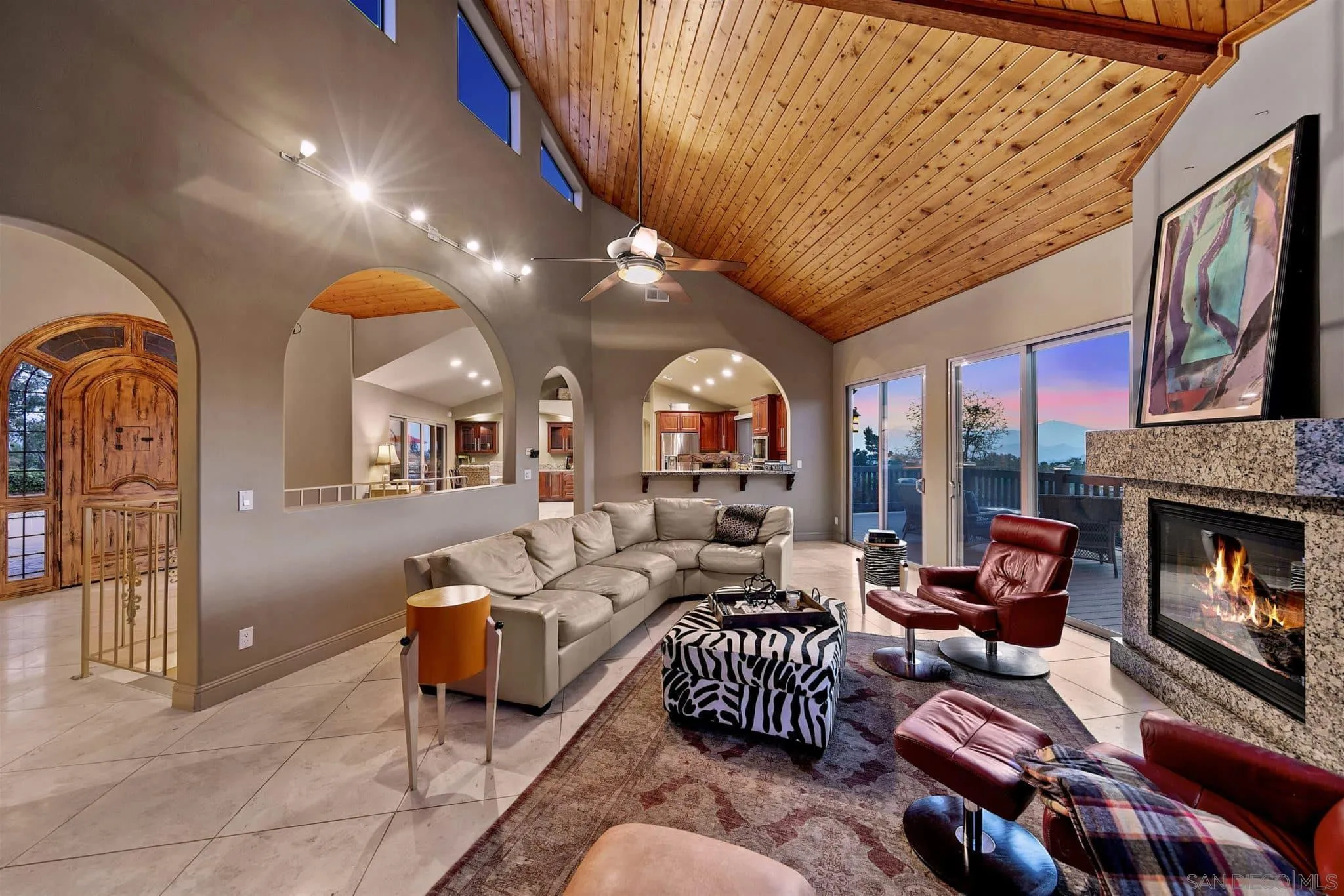 3480 Hidden Trail Drive Jamul, CA 91935 - Photo 18 of 38 a living room with furniture fireplace and a large window