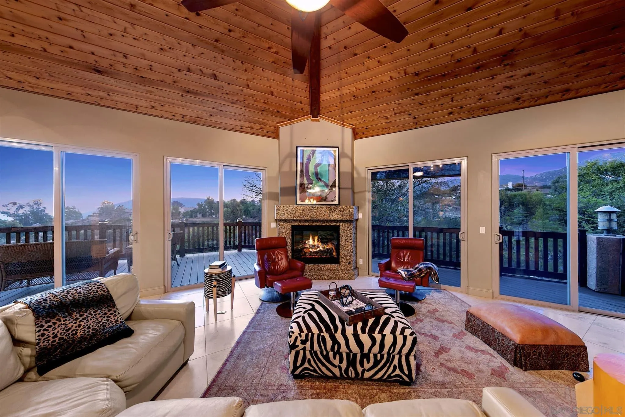 3480 Hidden Trail Drive Jamul, CA 91935 - Photo 19 of 38 a living room with furniture a fireplace and a chandelier
