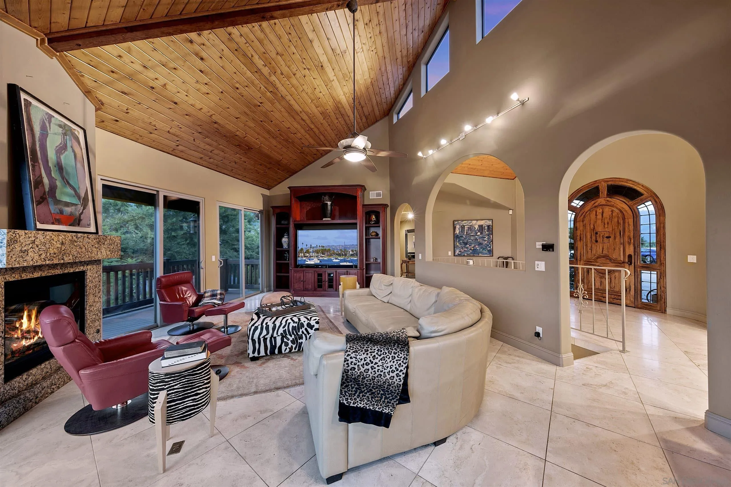 3480 Hidden Trail Drive Jamul, CA 91935 - Photo 21 of 38 a living room with furniture a fireplace and a flat screen tv