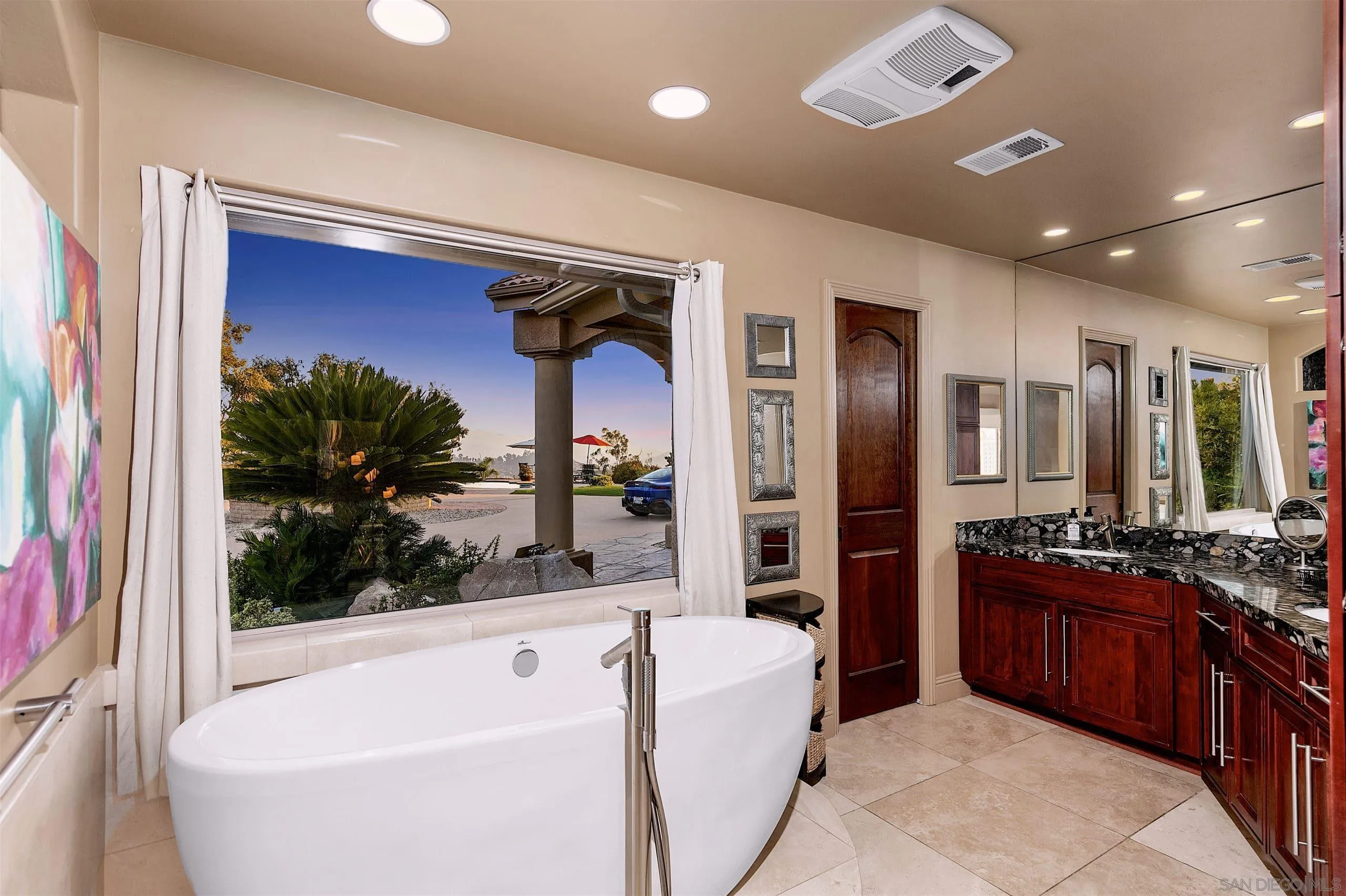 3480 Hidden Trail Drive Jamul, CA 91935 - Photo 28 of 38 a bathroom with a tub a sink a mirror and shower